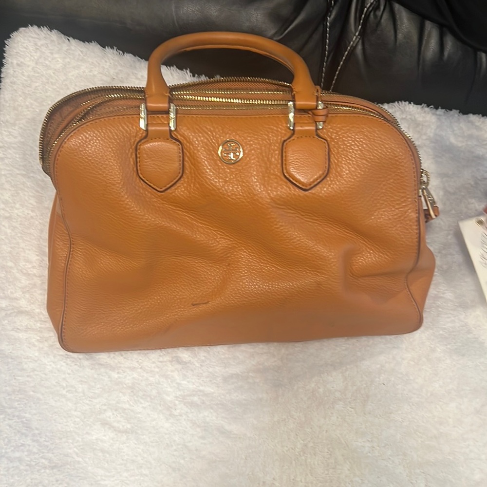 Brown Tory Birch purse with multiple pockets